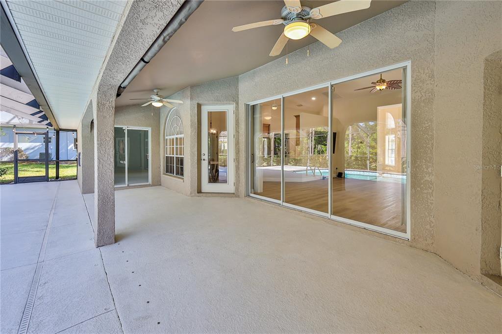 15031 Surrey Bend Spring Hill, FL 34609 - Photo 45 of 77 a view of an entryway with a glass door