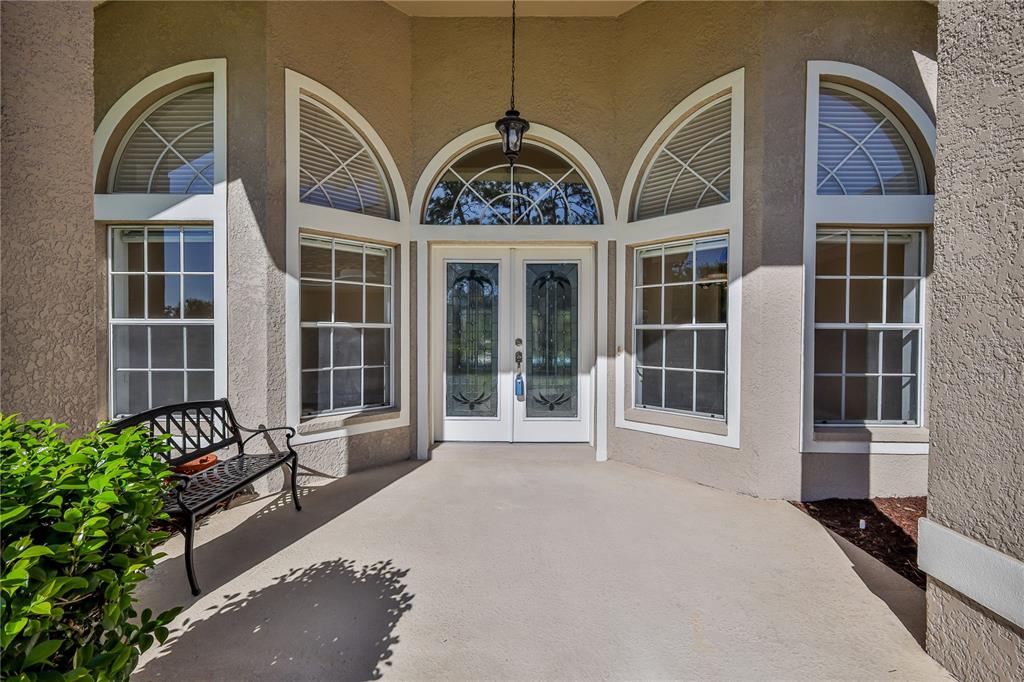 15031 Surrey Bend Spring Hill, FL 34609 - Photo 5 of 77 a front view of a house with a garden