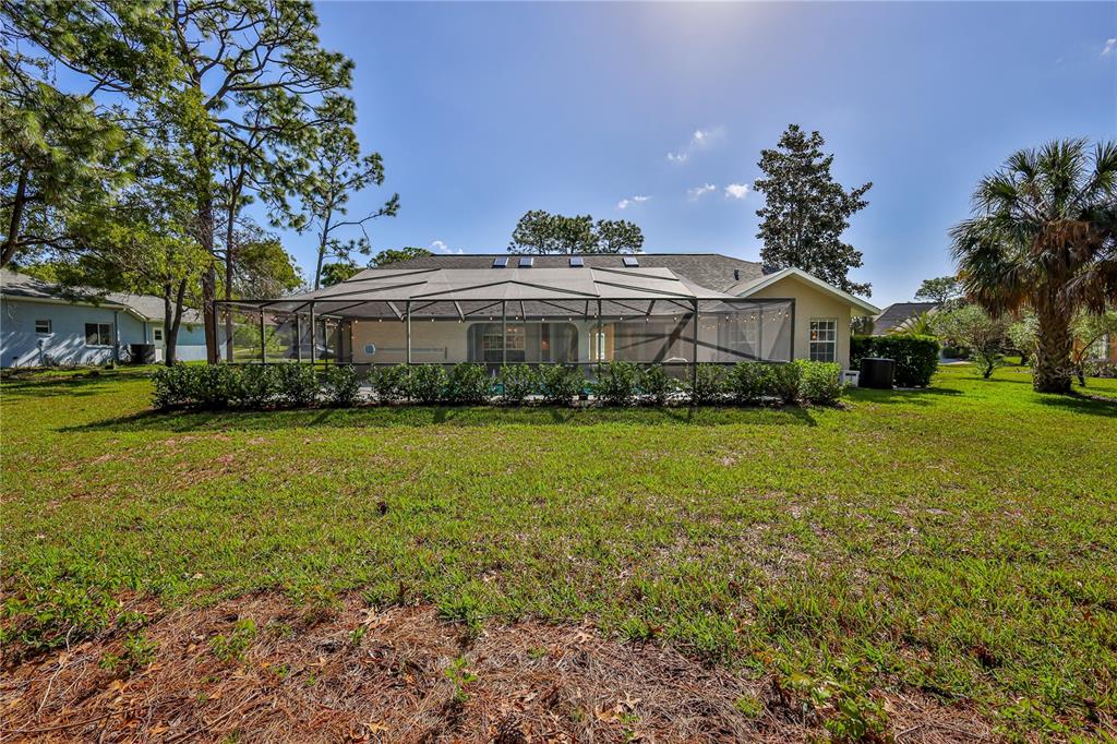 15031 Surrey Bend Spring Hill, FL 34609 - Photo 54 of 77 a front view of a house with a yard