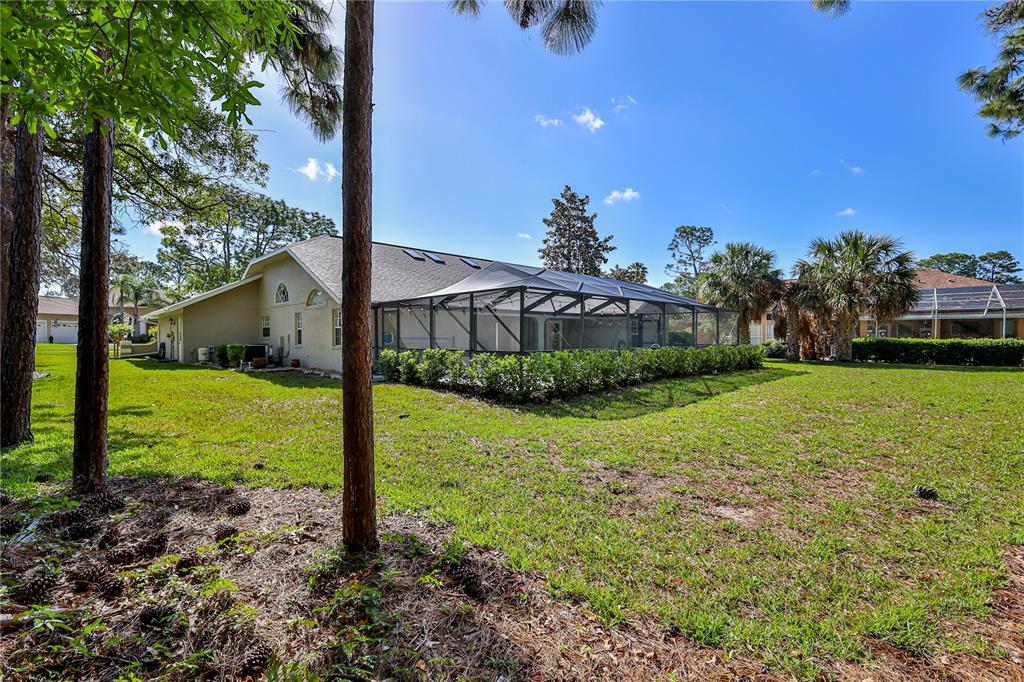 15031 Surrey Bend Spring Hill, FL 34609 - Photo 55 of 77 a view of a house with backyard and sitting area
