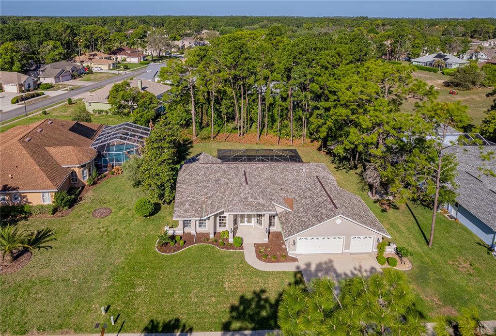 15031 Surrey Bend Spring Hill, FL 34609 - Photo 60 of 77 an aerial view of a house with yard swimming pool and outdoor seating