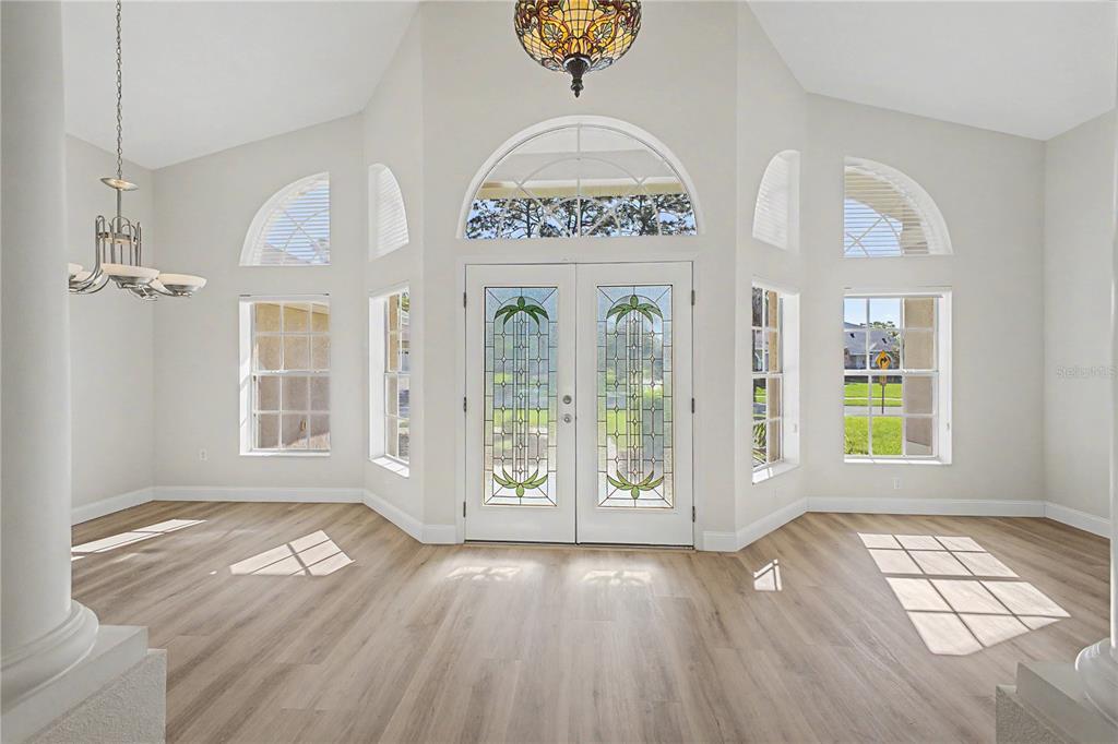 15031 Surrey Bend Spring Hill, FL 34609 - Photo 6 of 77 a view of an entryway with wooden floor