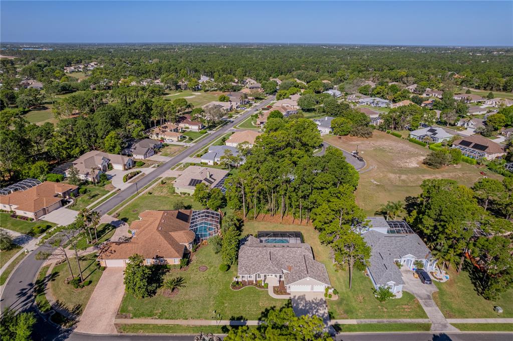15031 Surrey Bend Spring Hill, FL 34609 - Photo 61 of 77 an aerial view of residential house with outdoor space