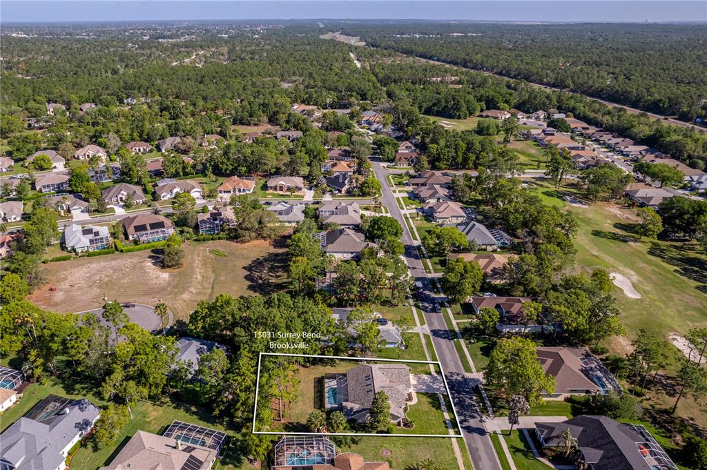 15031 Surrey Bend Spring Hill, FL 34609 - Photo 70 of 77 an aerial view of residential houses with outdoor space and river