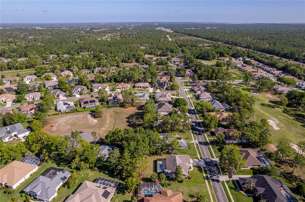 15031 Surrey Bend Spring Hill, FL 34609 - Photo 71 of 77 an aerial view of a city with lots of residential buildings