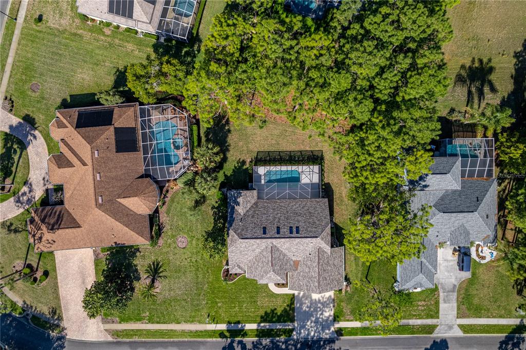 15031 Surrey Bend Spring Hill, FL 34609 - Photo 76 of 77 an aerial view of multiple houses with yard