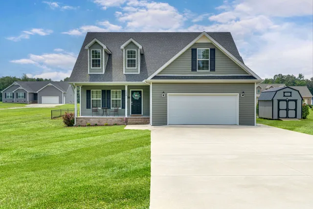 a front view of a house with a yard