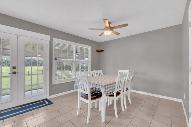 a view of a dining room with furniture window and outside view