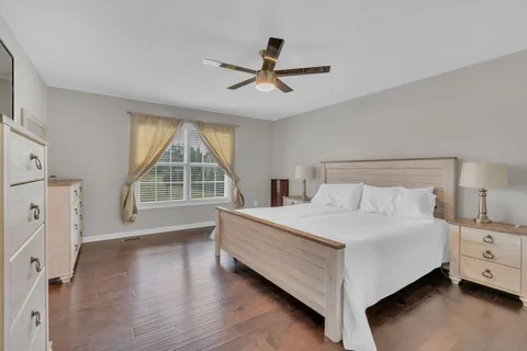 a bed room with a bed and a window