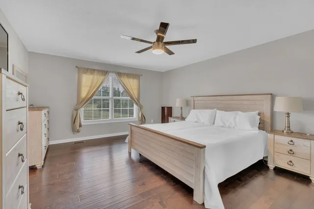 a bed room with a bed and a window