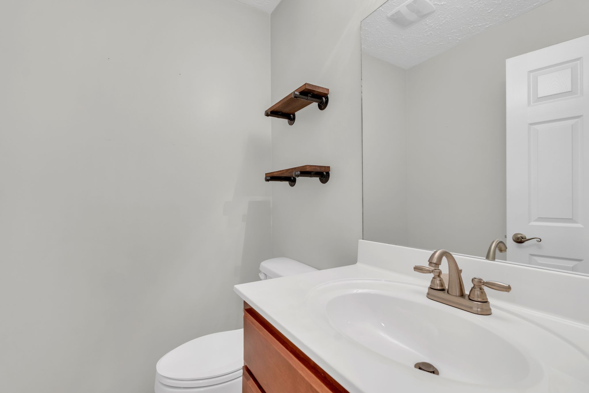 124 Houston Bell Road Manchester, TN 37355 - Photo 23 of 43 a bathroom with a sink a toilet and a mirror