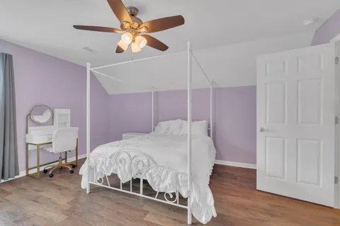 a bedroom with a bed and a table