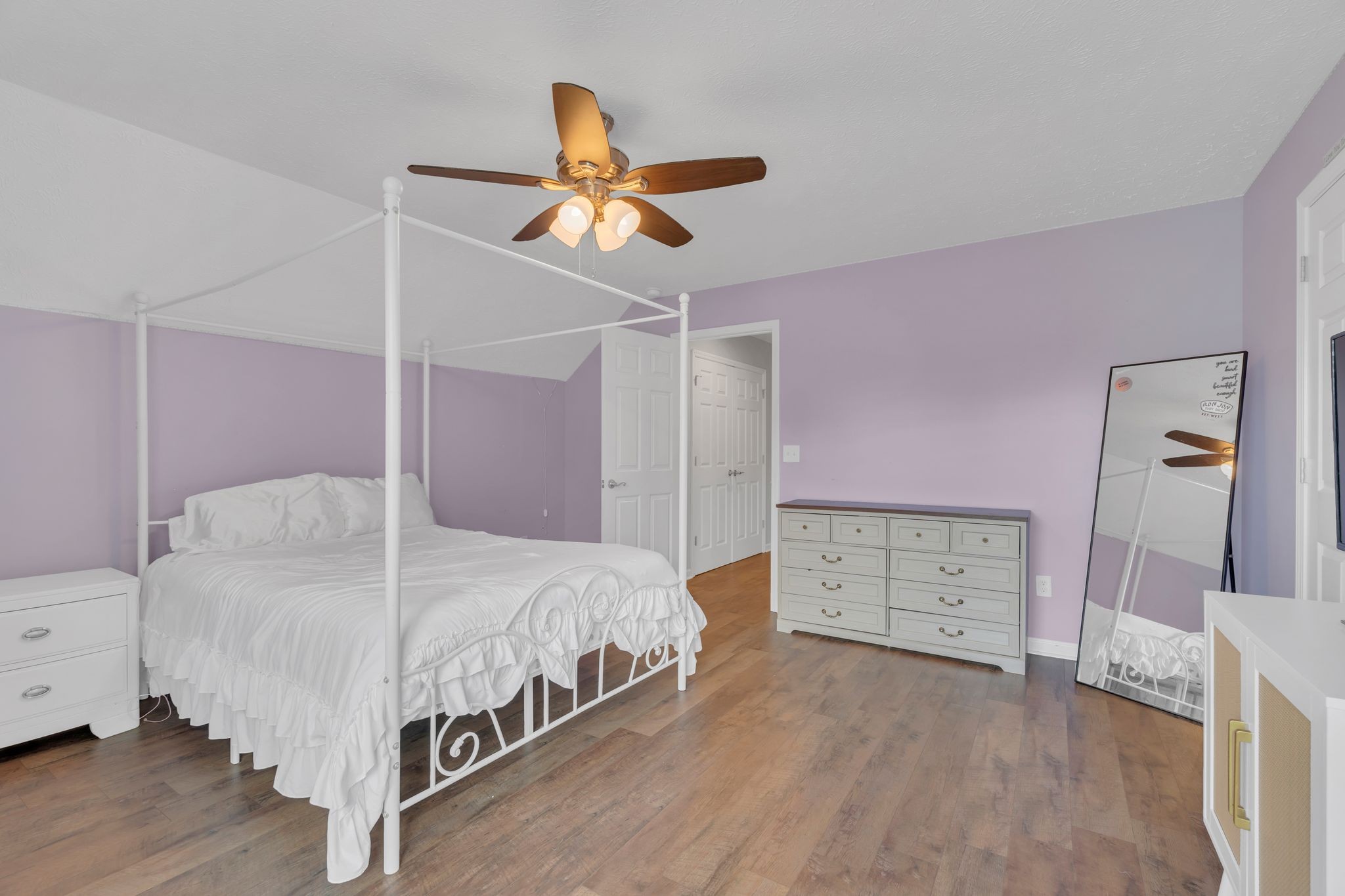 124 Houston Bell Road Manchester, TN 37355 - Photo 27 of 43 a bedroom with a bed and a chandelier