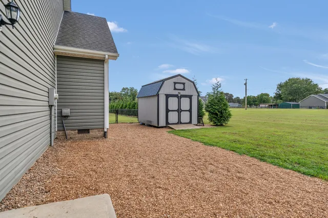 a view of a back yard of the house
