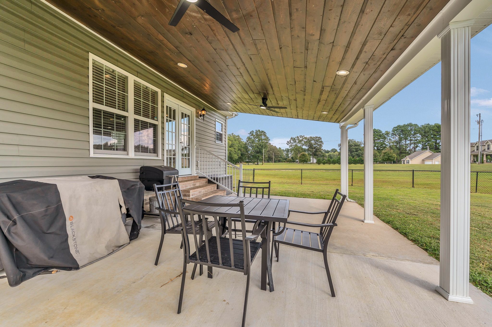 124 Houston Bell Road Manchester, TN 37355 - Photo 35 of 43 a view of a patio with a table chairs and backyard