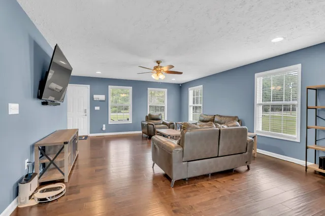 a living room with furniture and a flat screen tv