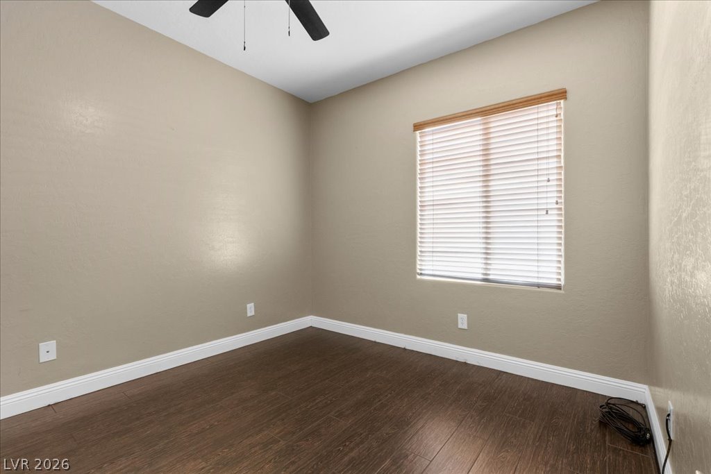 2627 Dirleton Place Henderson, NV 89044 - Photo 27 of 42 Hardwood look tile floors and a window with blinds define this inviting room