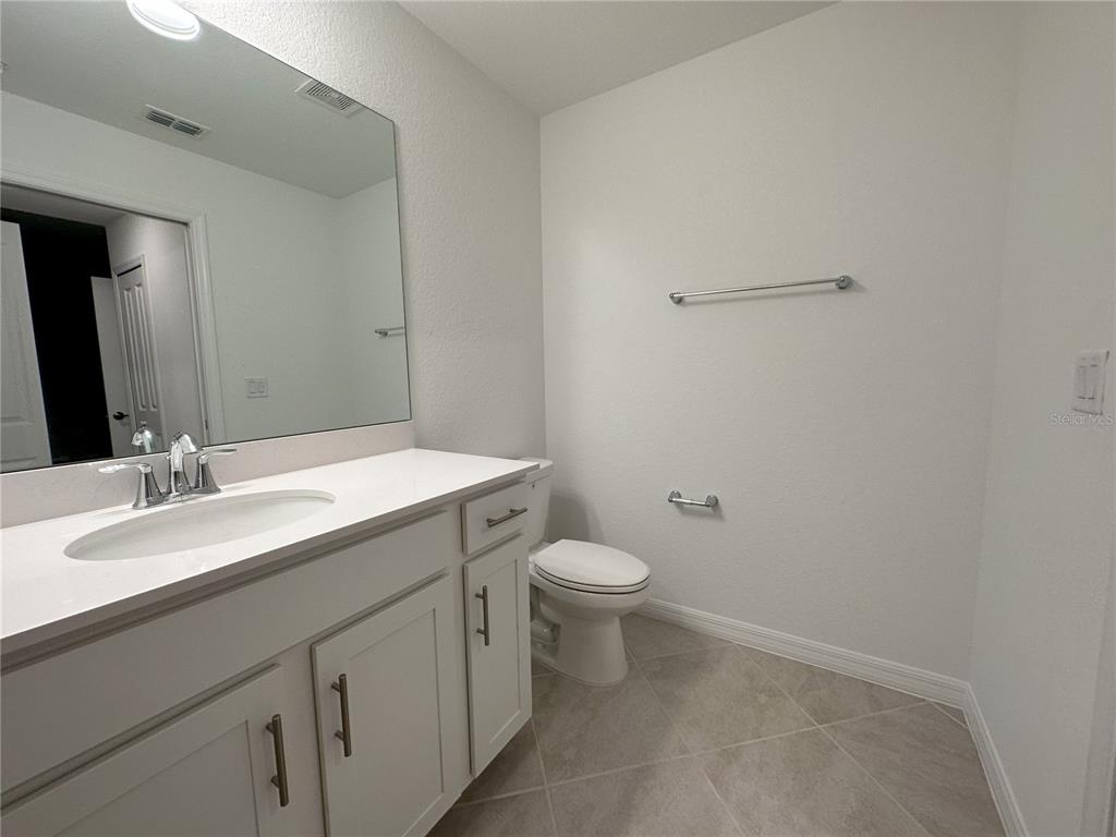 14131 Heritage Landing Boulevard, Unit 822 Punta Gorda, FL 33955 - Photo 14 of 51 a bathroom with a sink a toilet and mirror