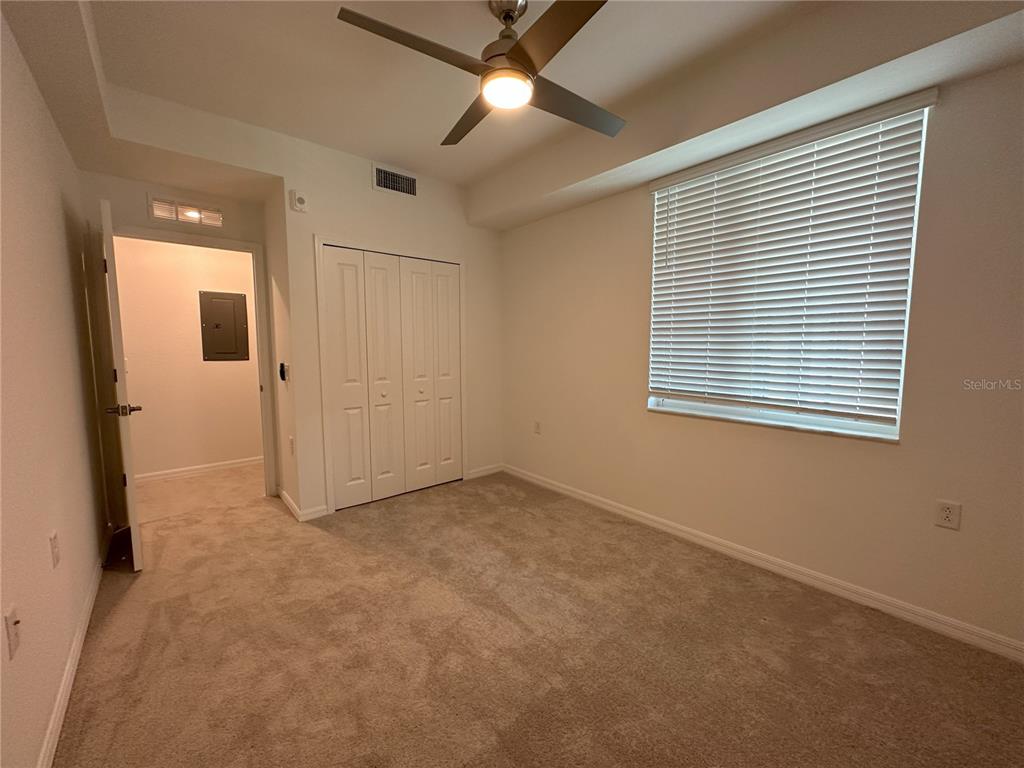14131 Heritage Landing Boulevard, Unit 822 Punta Gorda, FL 33955 - Photo 17 of 51 en empty room with windows and a ceiling fan