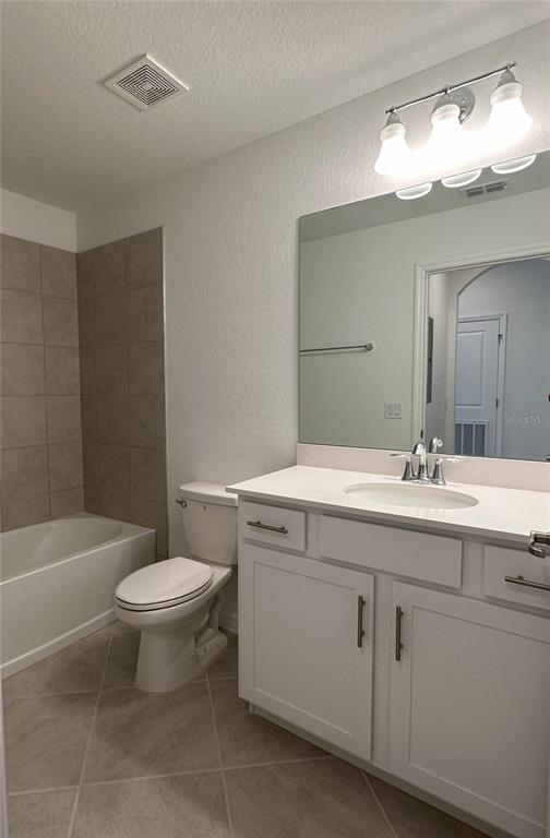 14131 Heritage Landing Boulevard, Unit 822 Punta Gorda, FL 33955 - Photo 19 of 51 a bathroom with a granite countertop sink a toilet and a mirror