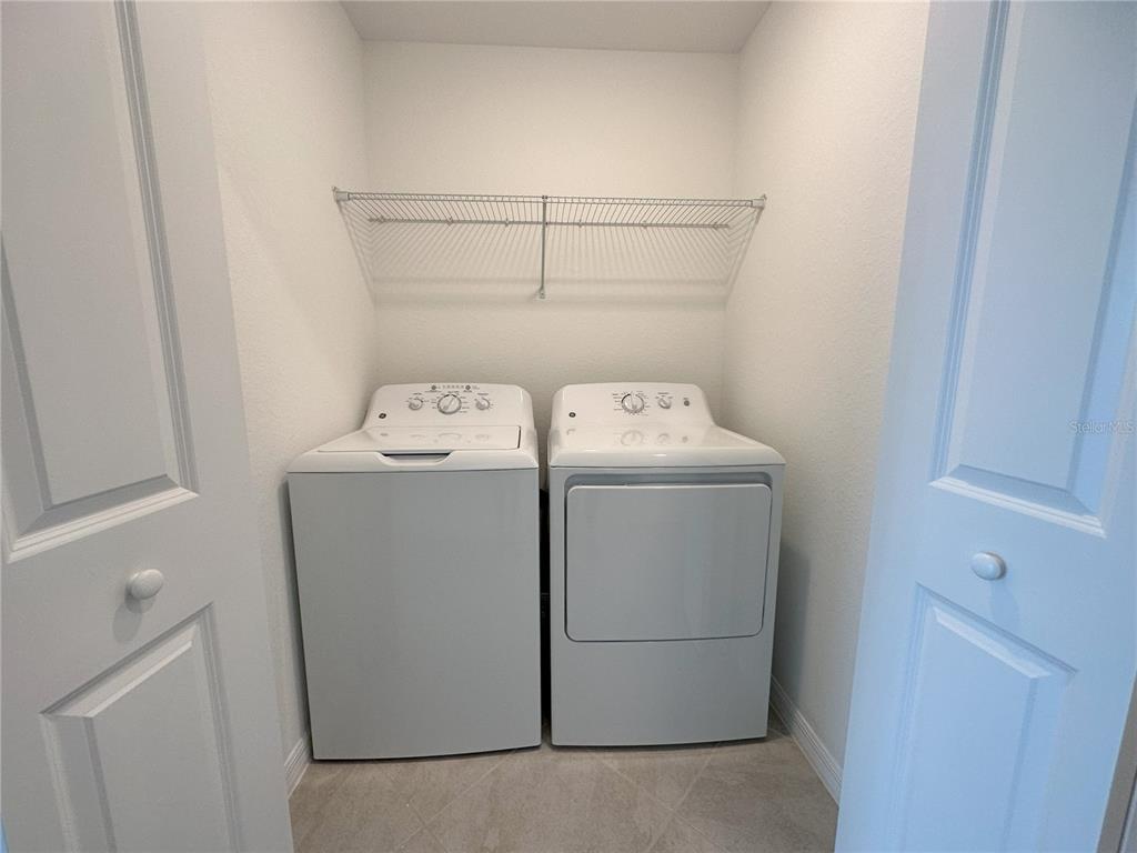 14131 Heritage Landing Boulevard, Unit 822 Punta Gorda, FL 33955 - Photo 20 of 51 a utility room with dryer and washer