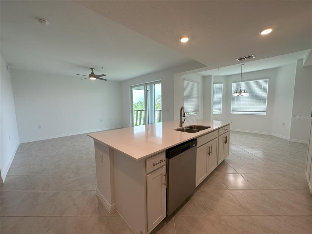 14131 Heritage Landing Boulevard, Unit 822 Punta Gorda, FL 33955 - Photo 8 of 51 a large kitchen with a sink and dishwasher
