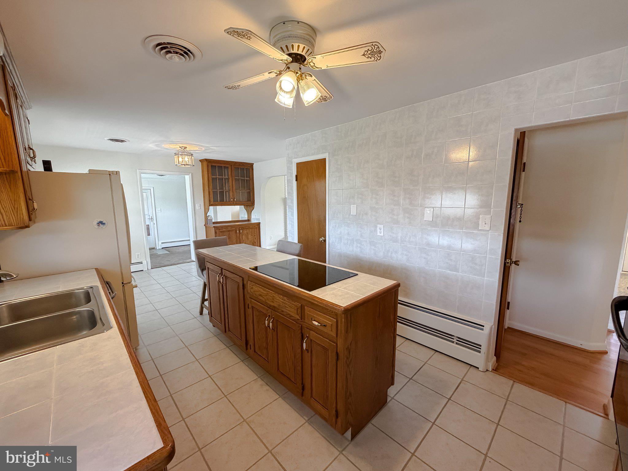 23230 Colton Point Road Avenue, MD 20609 - Photo 18 of 63 Spacious kitchen with island charm.