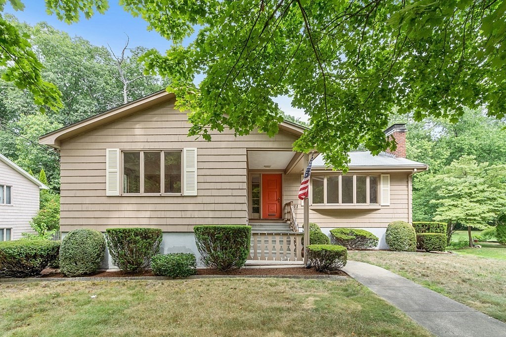 a front view of a house with a yard