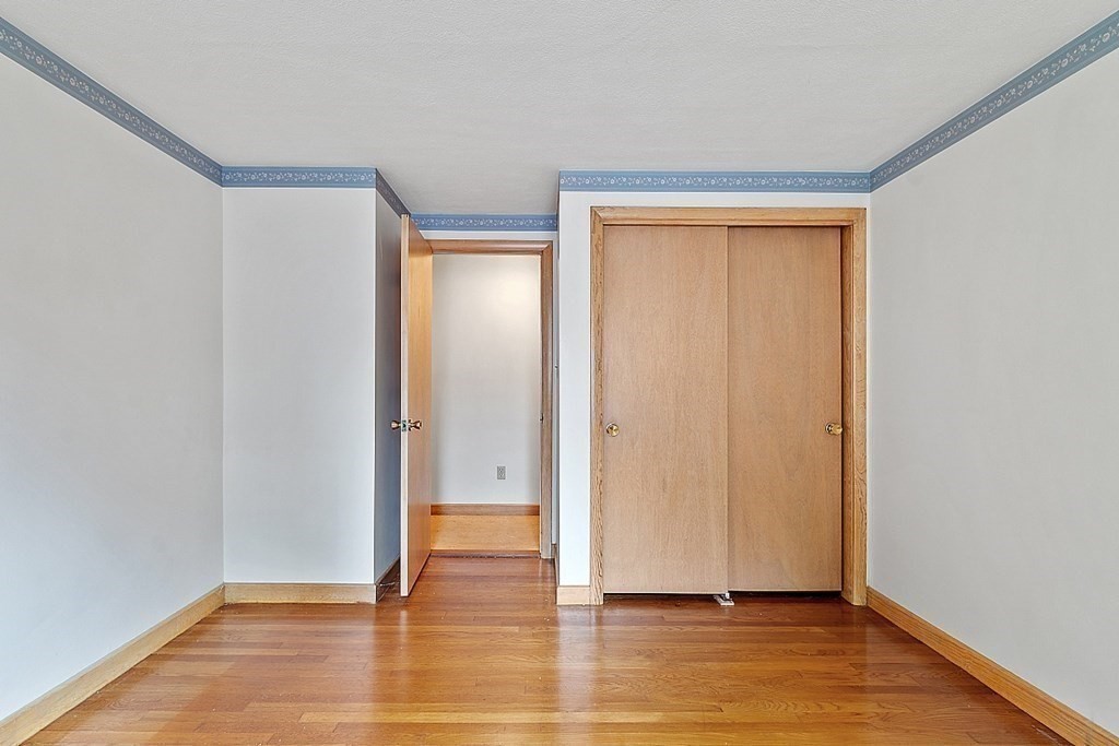 911 Main Street Reading, MA 01867 - Photo 15 of 42 a view of empty room with wooden floor