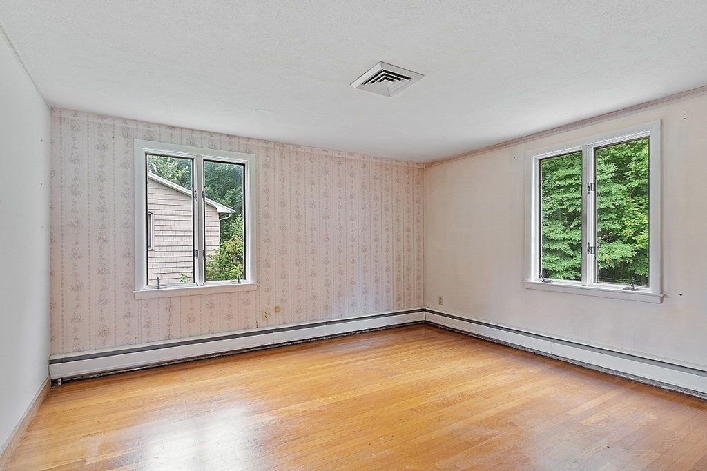 911 Main Street Reading, MA 01867 - Photo 16 of 42 an empty room with a window