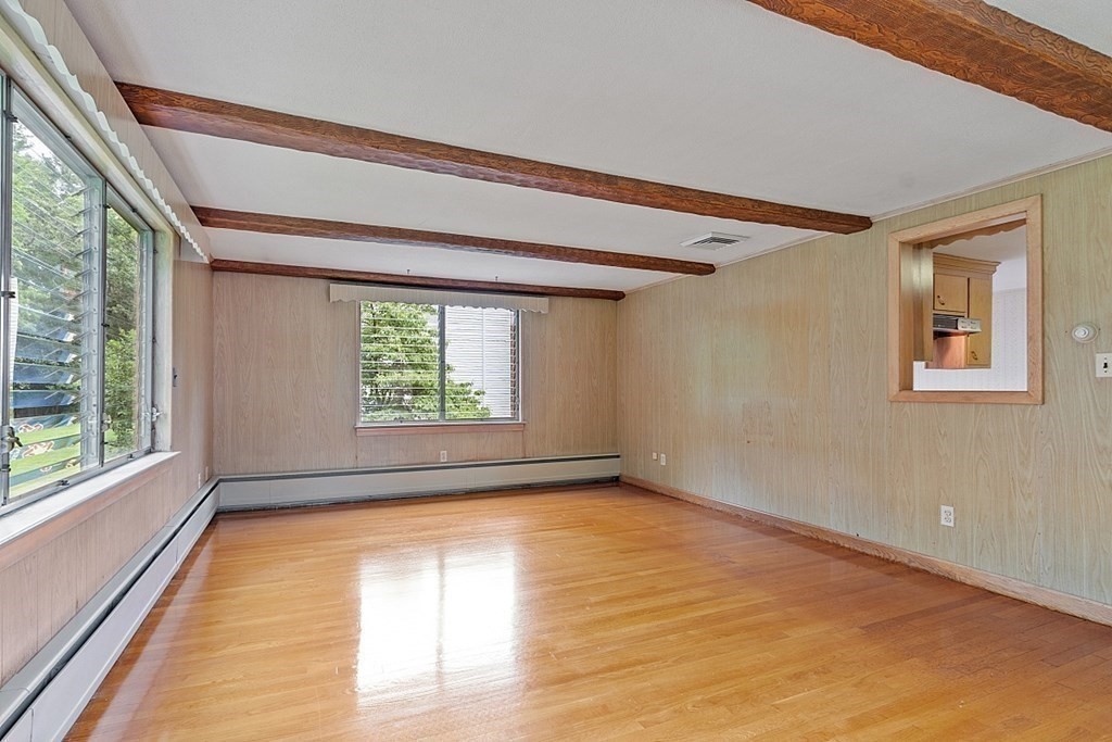 911 Main Street Reading, MA 01867 - Photo 21 of 42 a view of an empty room with a window