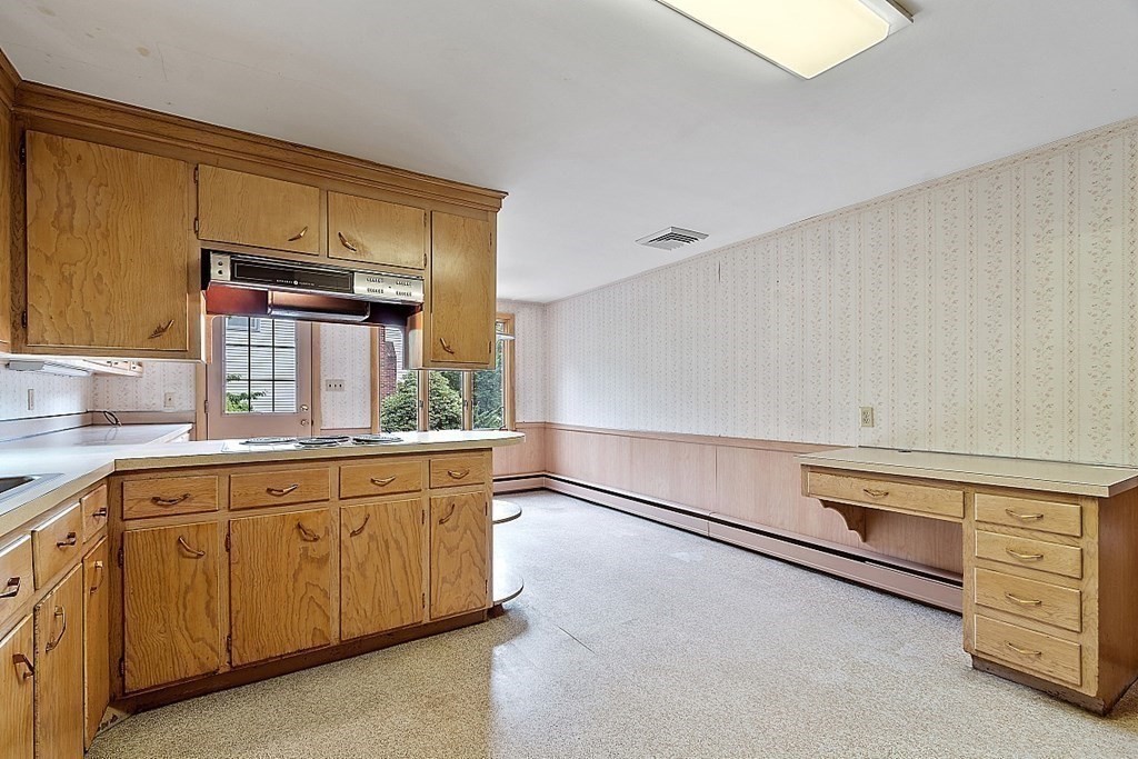 911 Main Street Reading, MA 01867 - Photo 26 of 42 a room with storage and utility