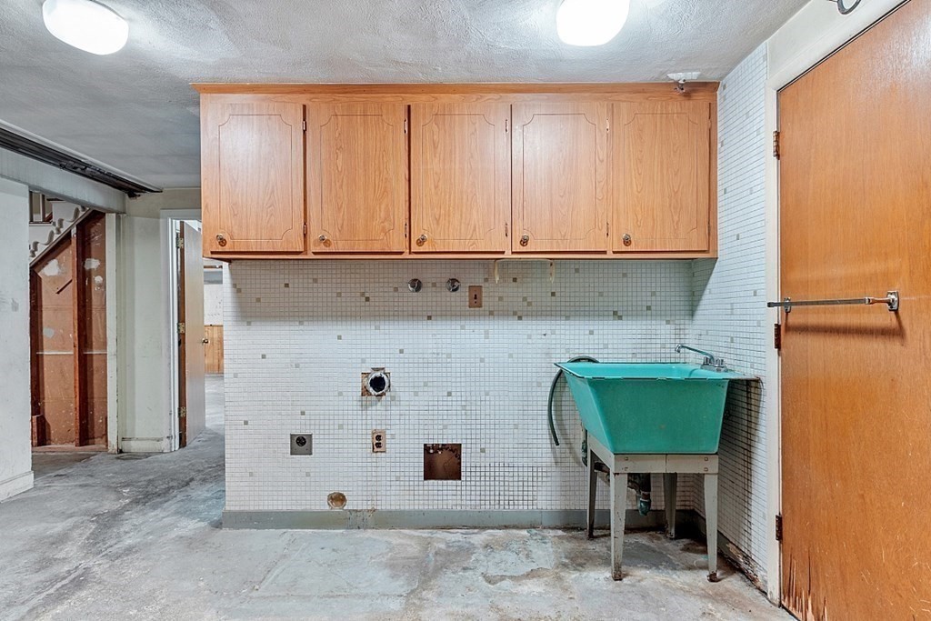 911 Main Street Reading, MA 01867 - Photo 34 of 42 a view of kitchen with wooden cabinets