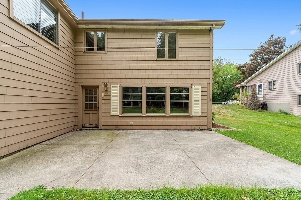 911 Main Street Reading, MA 01867 - Photo 39 of 42 a view of a house with a yard