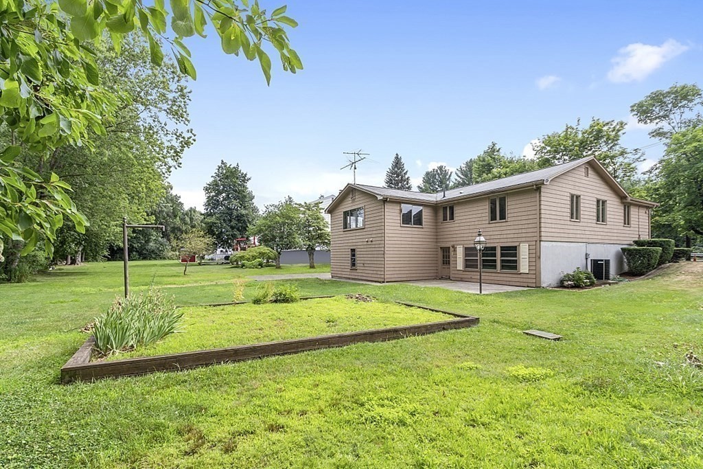 911 Main Street Reading, MA 01867 - Photo 40 of 42 a house view with a outdoor space