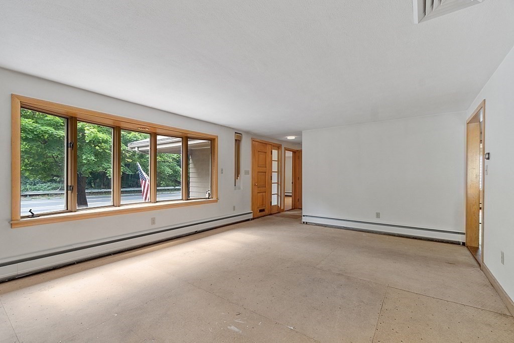 911 Main Street Reading, MA 01867 - Photo 10 of 42 an empty room with windows