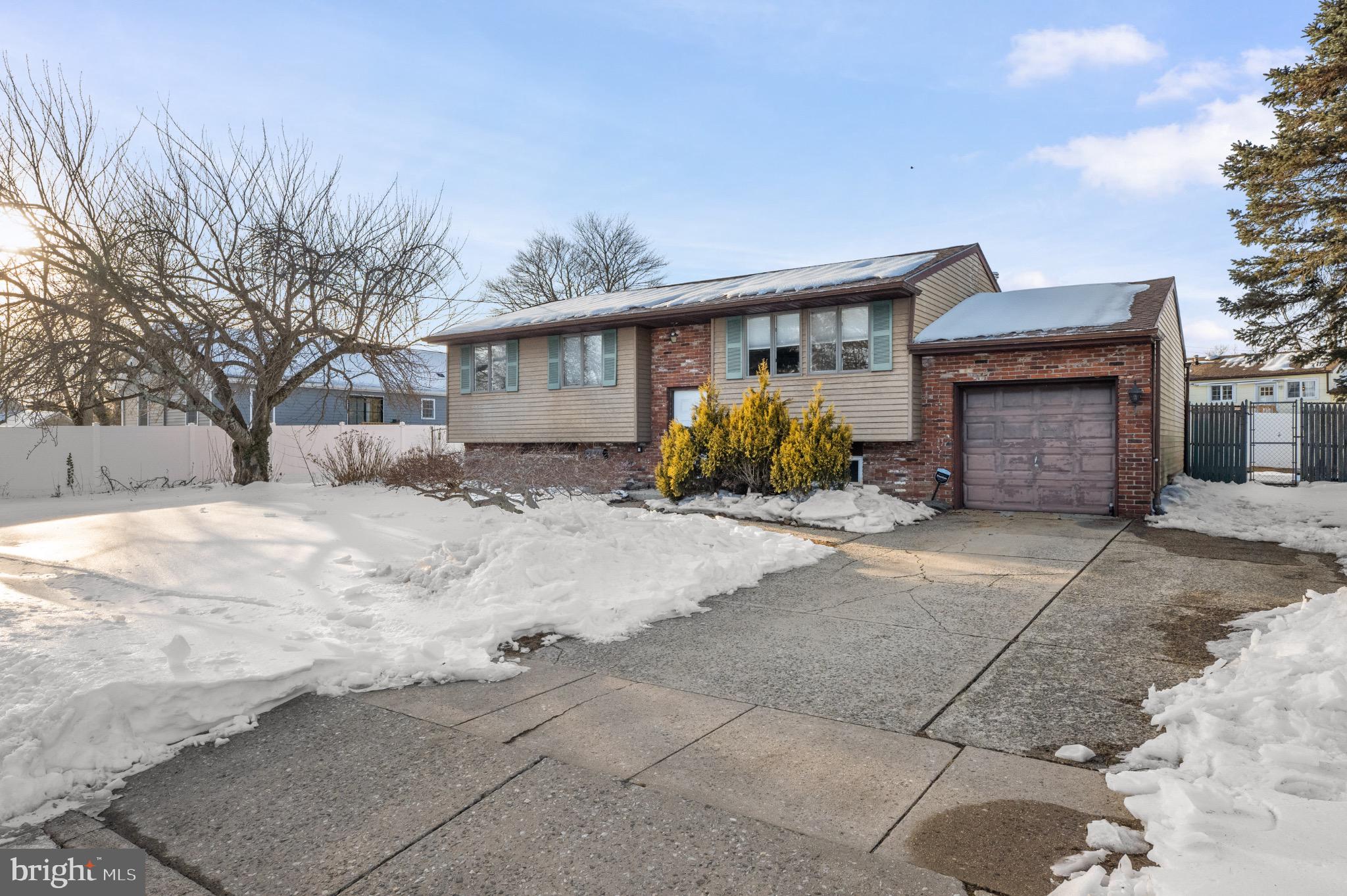 53 Jobs Lane Williamstown, NJ 08094 - Photo 3 of 32 a front view of a house with a yard and garage