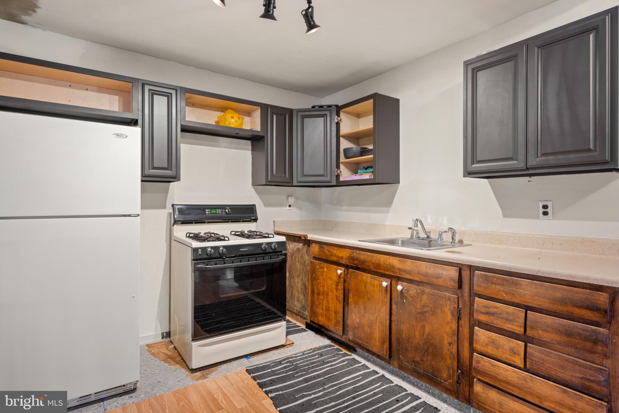53 Jobs Lane Williamstown, NJ 08094 - Photo 9 of 32 a kitchen with stainless steel appliances granite countertop a stove a sink and a microwave