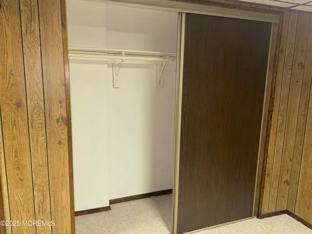 a view of a house with a backyard and deck