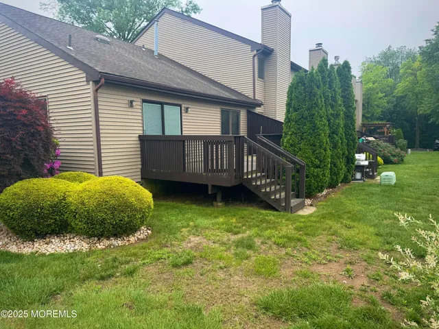 a view of a park with slide and a bench