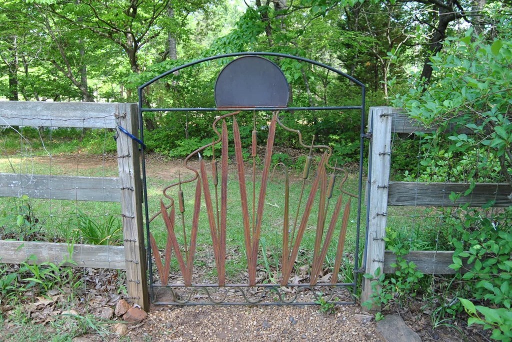 249 Bolingview Road Juliette, GA 31046 - Photo 12 of 45 a view of a yard with plants and outdoor seating