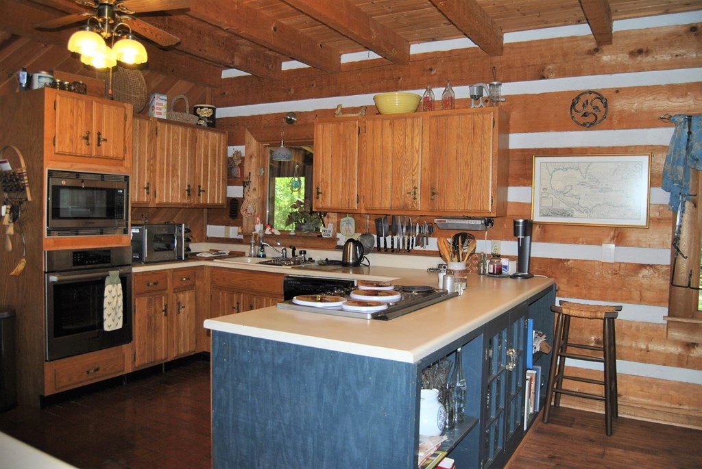 249 Bolingview Road Juliette, GA 31046 - Photo 24 of 45 a kitchen with stainless steel appliances a sink stove and cabinets