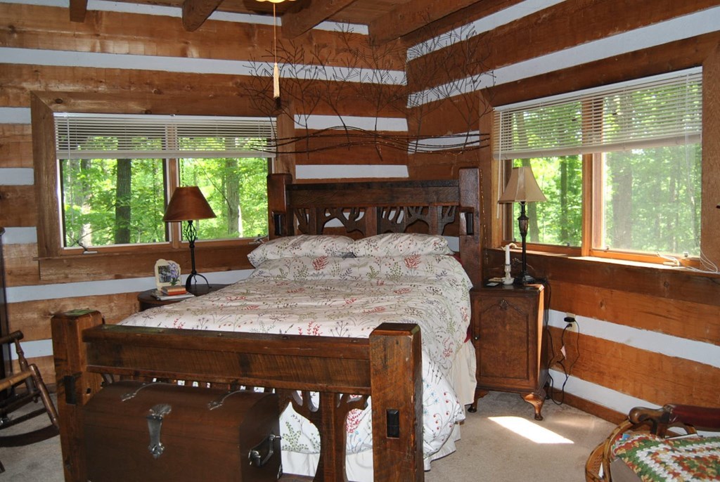 249 Bolingview Road Juliette, GA 31046 - Photo 26 of 45 a bedroom with a bed and a large window
