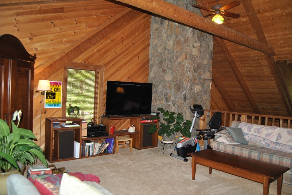 249 Bolingview Road Juliette, GA 31046 - Photo 31 of 45 a living room with furniture and a flat screen tv