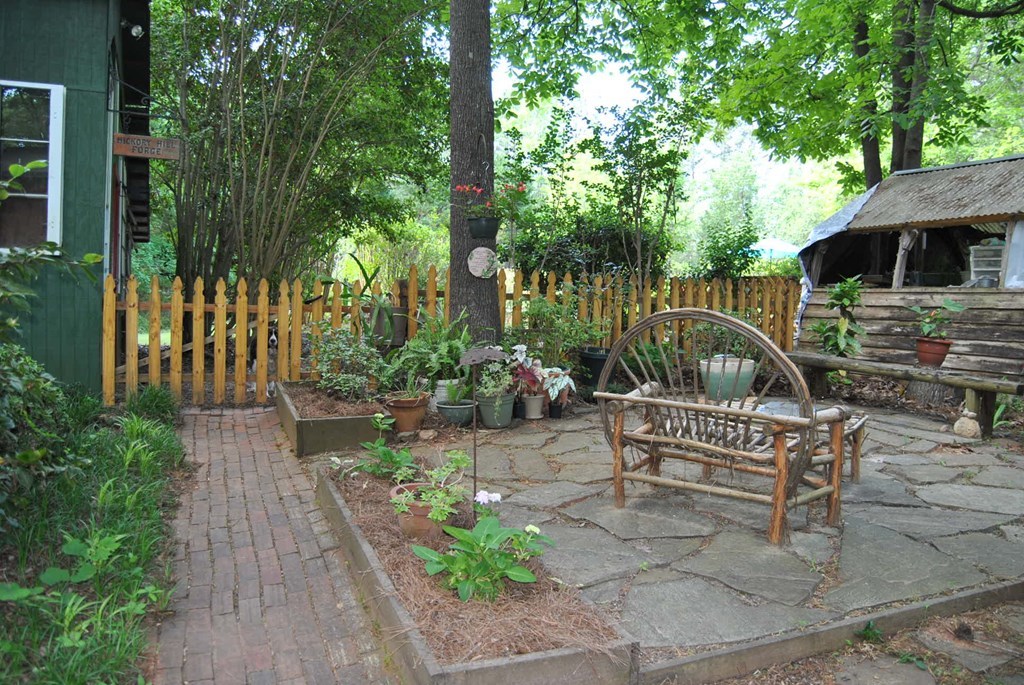249 Bolingview Road Juliette, GA 31046 - Photo 9 of 45 a view of a bench in the backyard