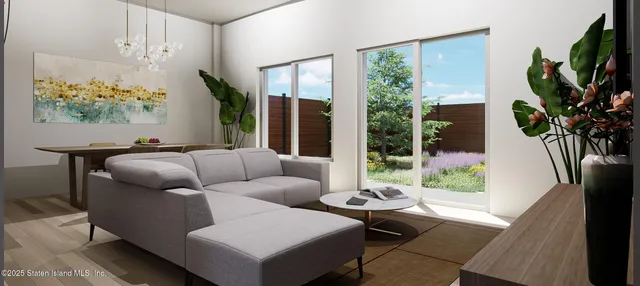 a living room with furniture fireplace and a large window