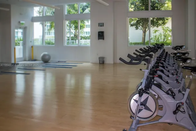 a view of swimming pool with palm trees