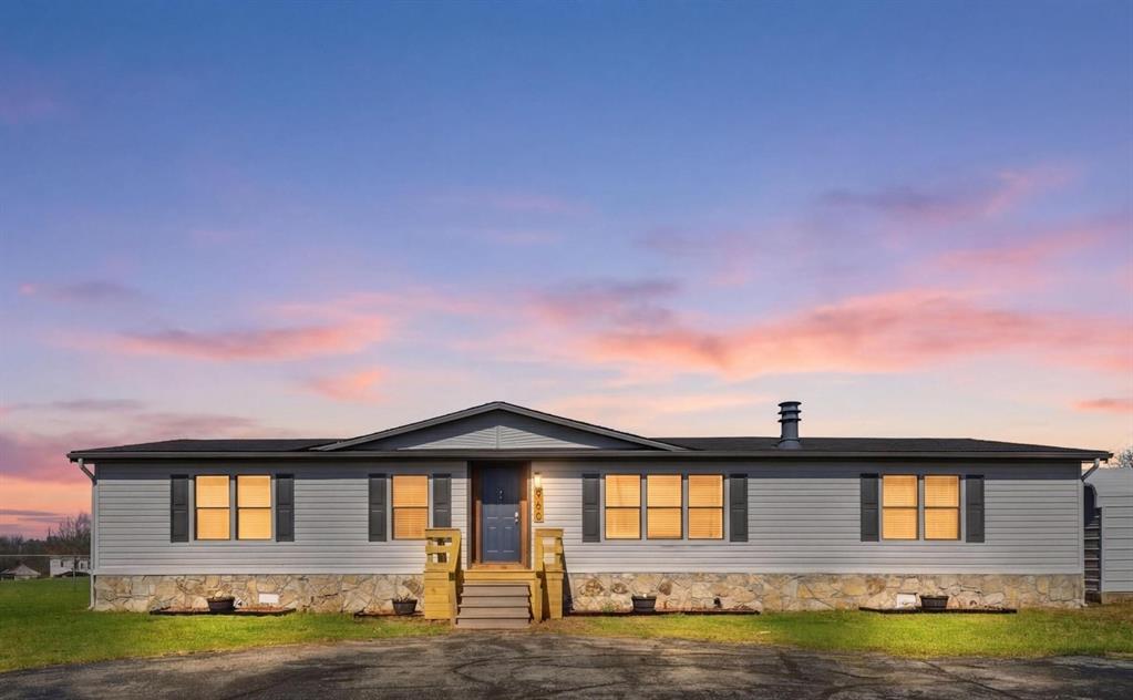 960 Pecan Street Azle, TX 76020 - Photo 1 of 34 a front view of a house with a yard