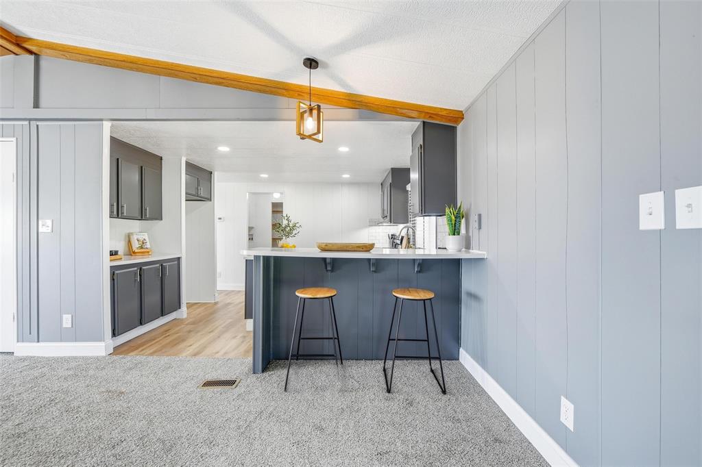 960 Pecan Street Azle, TX 76020 - Photo 12 of 34 a view of kitchen with dining area and chandelier