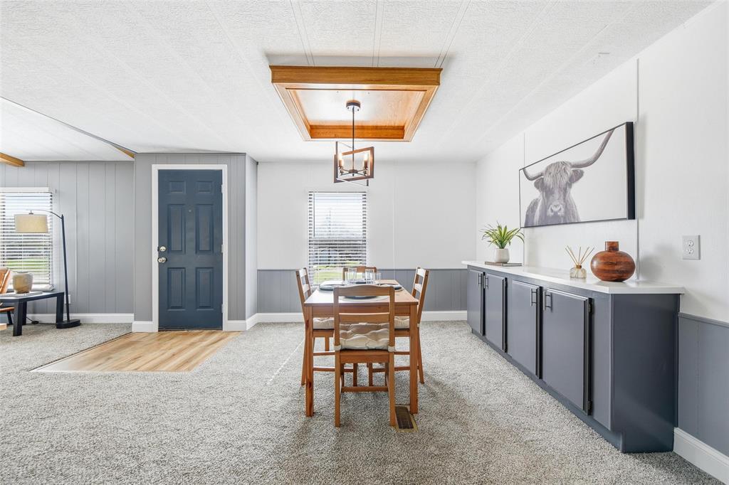 960 Pecan Street Azle, TX 76020 - Photo 13 of 34 a view of a dining room with furniture and a chandelier